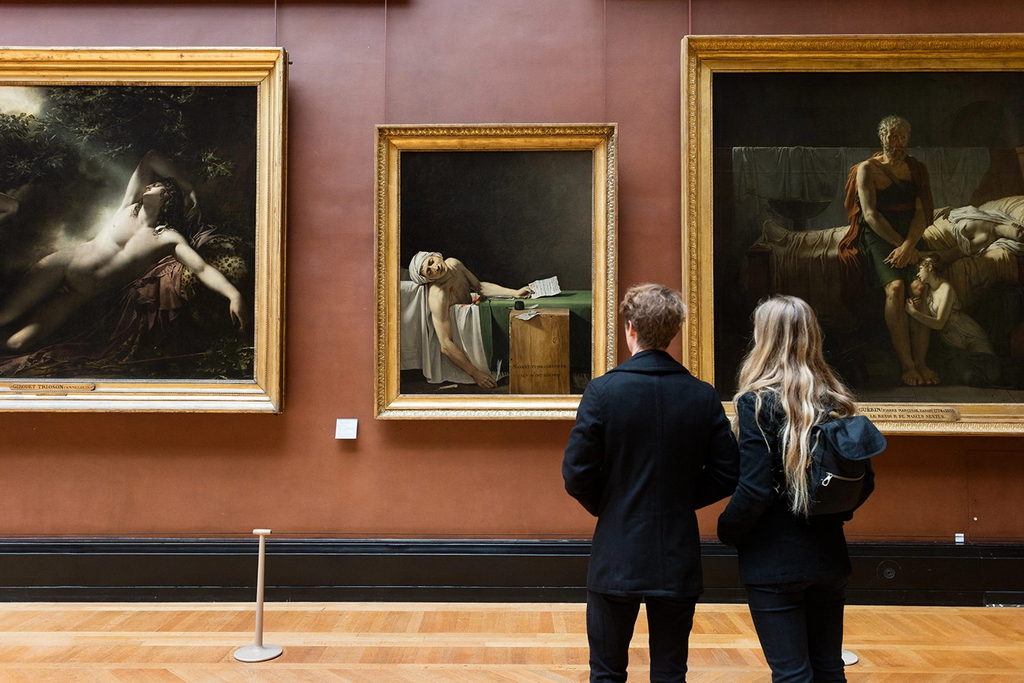 Visitors in the great gallery of the Louvre